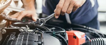 Automobile mechanic repairman hands repairing a car engine automotive workshop with a wrench, car service and maintenance,Repair service.